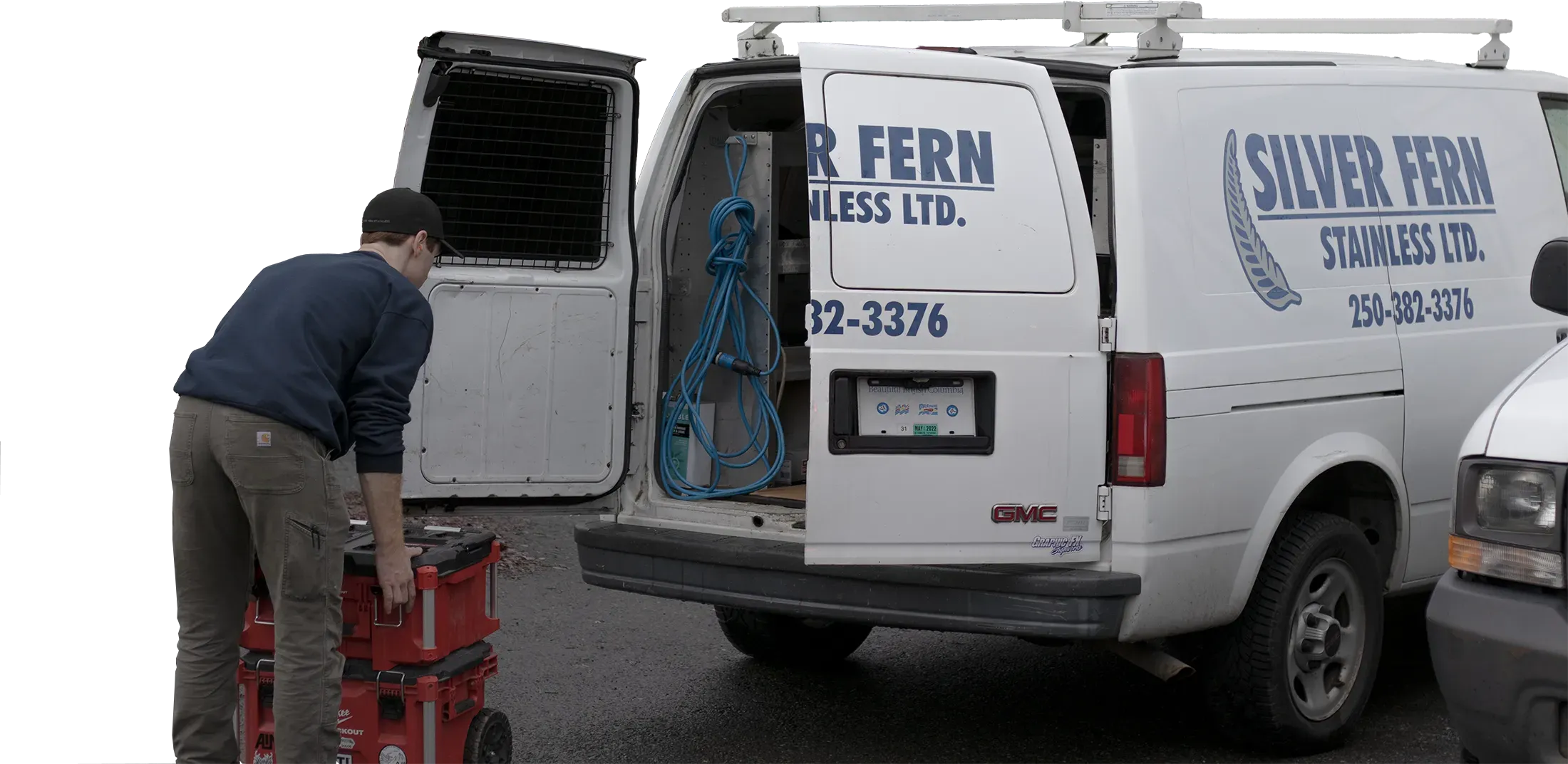 Picture of a worker at Silver Fern Stainless loading tools into his work van in Victoria BC